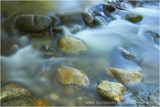 Royalty Free Stock Photo: Silky Water and Shiny Rocks
