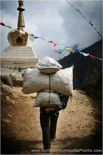 Royalty Free Stock Image: Porter Passing A Stupa