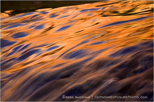Royalty Free Stock Photo: Orange Cliffs Reflected in the Virgin River