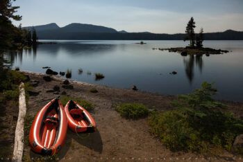 Kayaks along the lake stock image, waldo lake, oregon Kayaks along the lake stock image, waldo lake, oregon