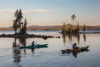 kayaks in the lake 2 stock image, waldo lake, oregon kayaks in the lake 2 stock image, waldo lake, oregon